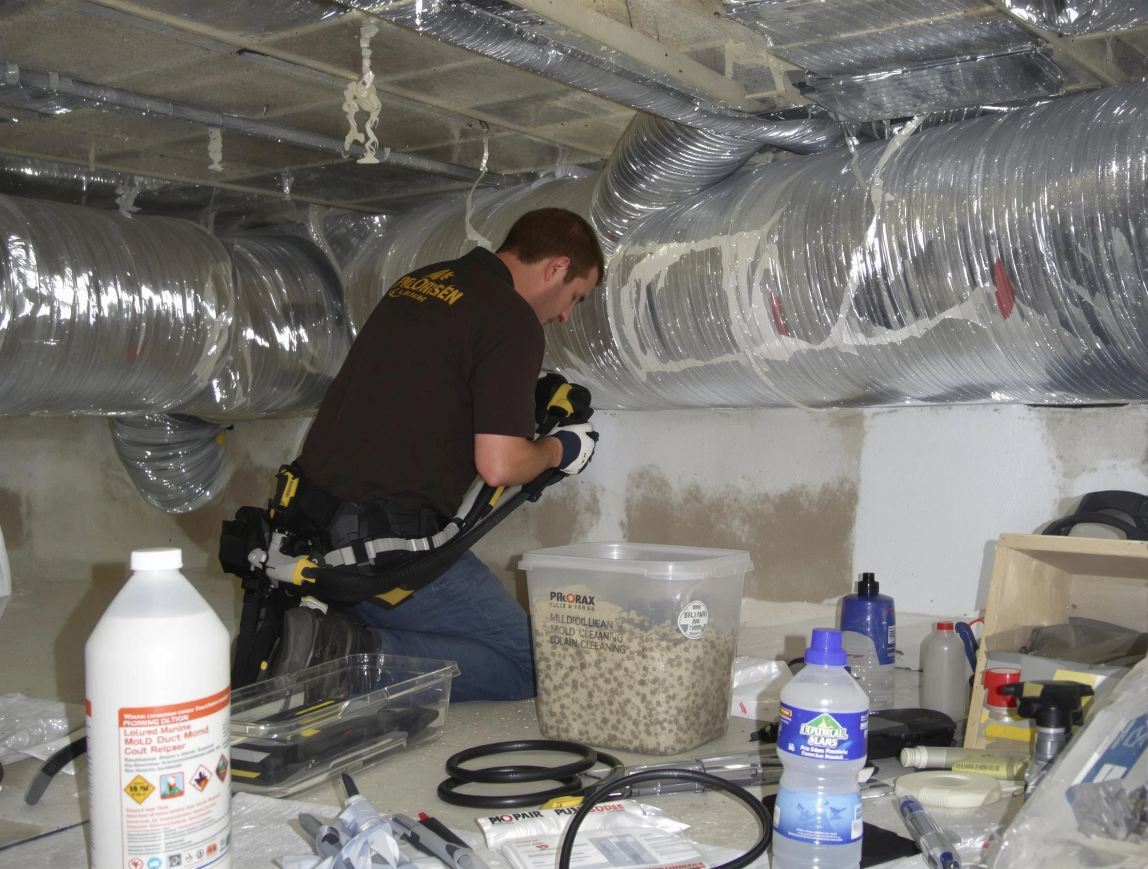 Brookline Air Duct Cleaning specialist performing professional mold removal from air ducts in Brookline